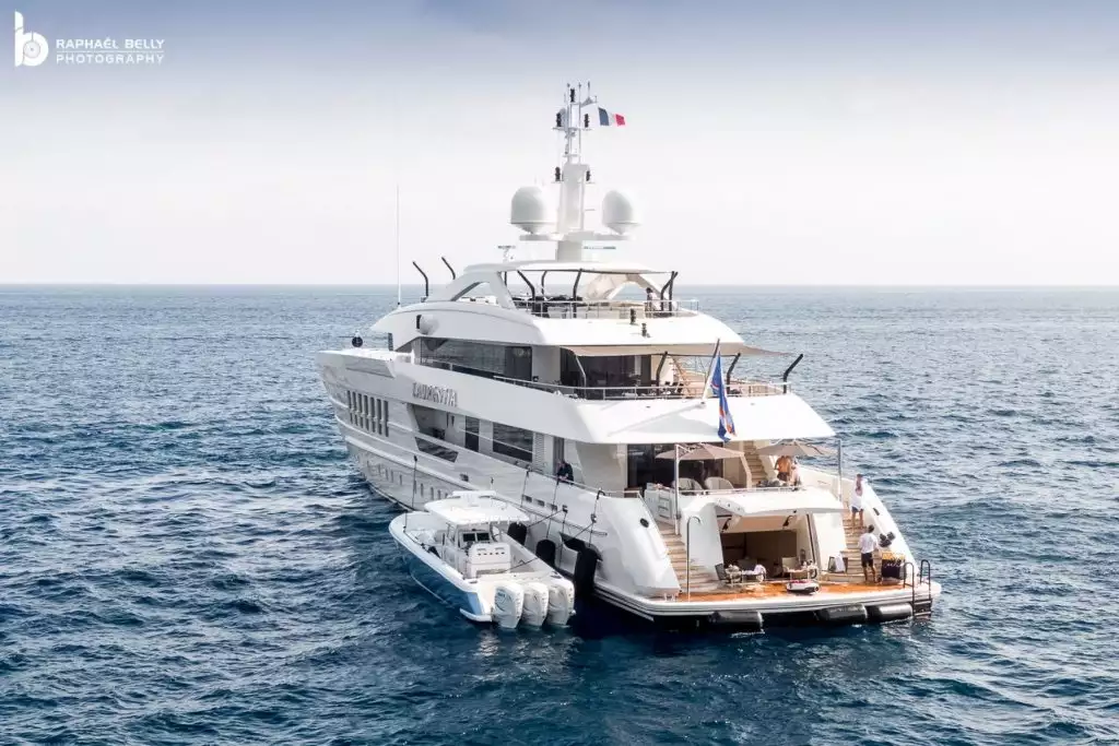 Affluent Couple Showcasing Wealth with Mansion Yacht and Luxury